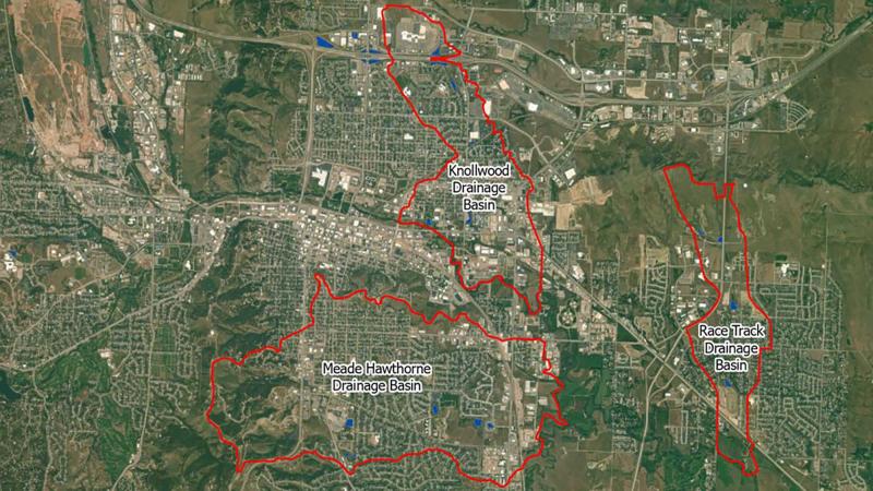 Satellite image of the Meade Hawthorne, Knollwood, and Race Track Drainage basins. The basins are outlined in a red border.