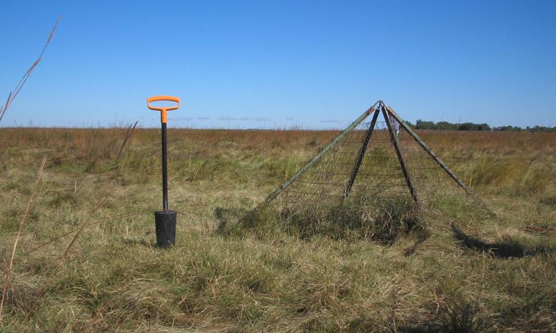 Tools for measuring grassland growth placed in a rangeland project area.