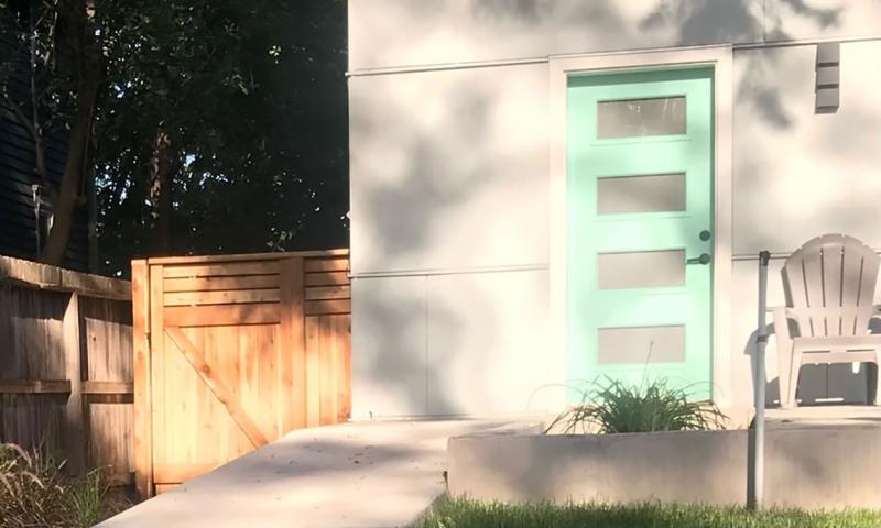 A a gently sloping ramp walkway leading to a home with a no-step entrance.