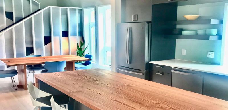 Kitchen area of a modern, adaptable home with ample space around essential features.