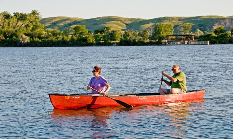 Couple canoing in a river.