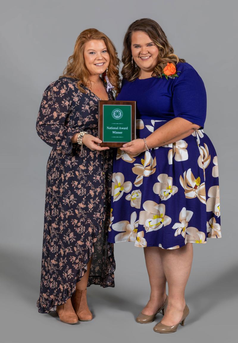Hilary Risner and Caroline Hansen accepting the Citizenship in 4-H Youth Development national award.
