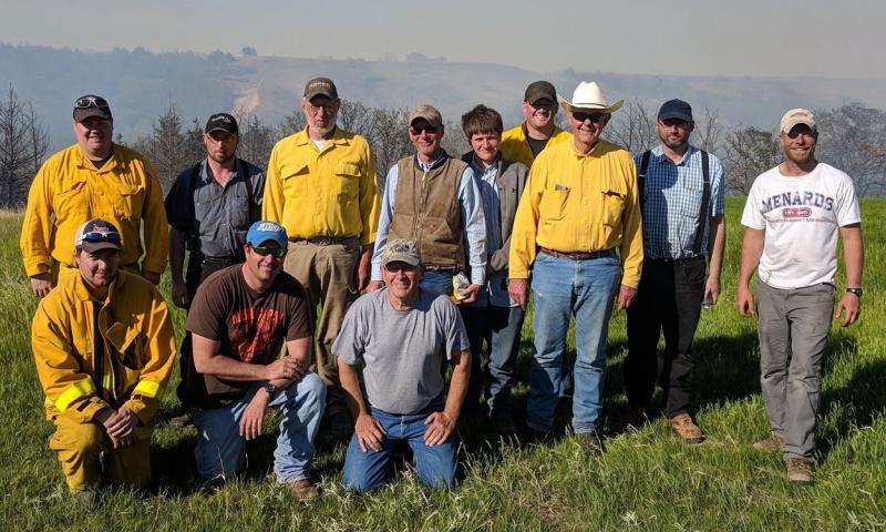 Precribed burn crew gathered after the burn on Tom Hausmann’s land.