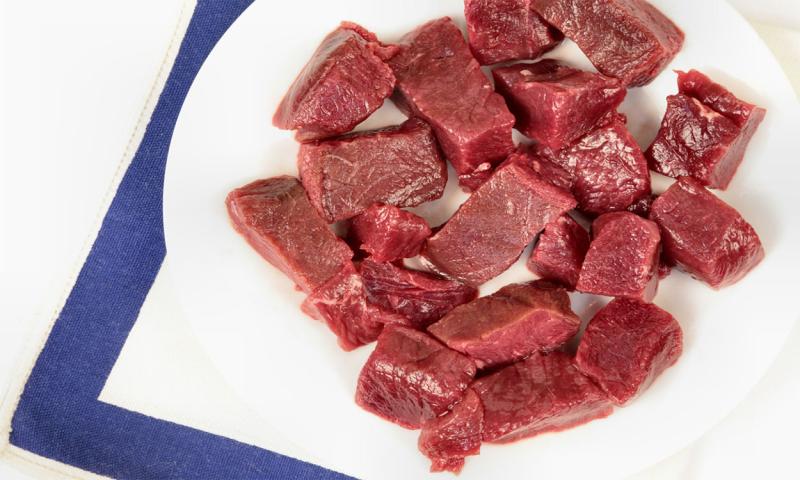 Cubes of lean venison on a plate.