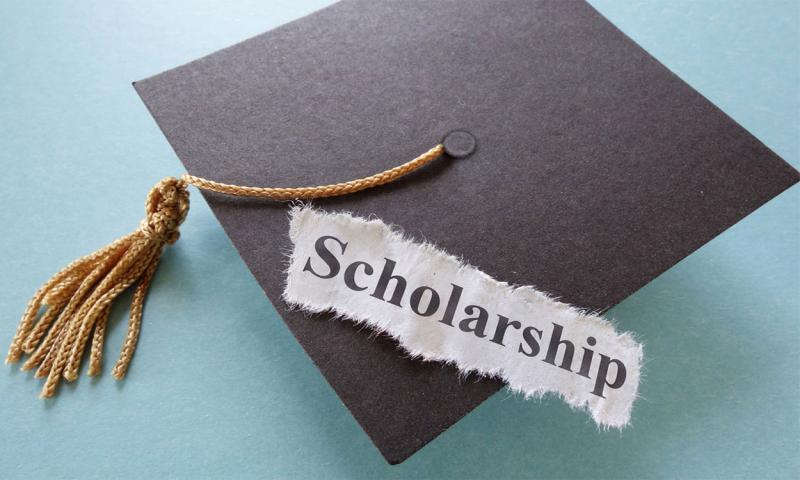 Graduation cap and tassel. Text reading “Scholarship.”