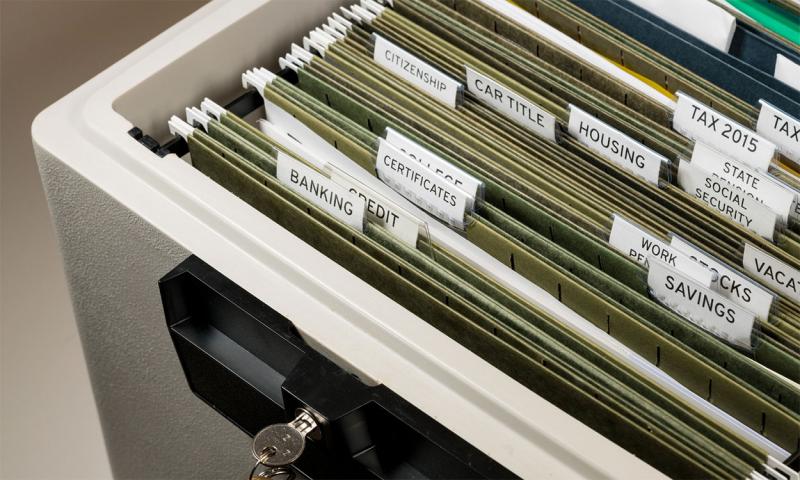 Fireproof file safe with important documents inside.