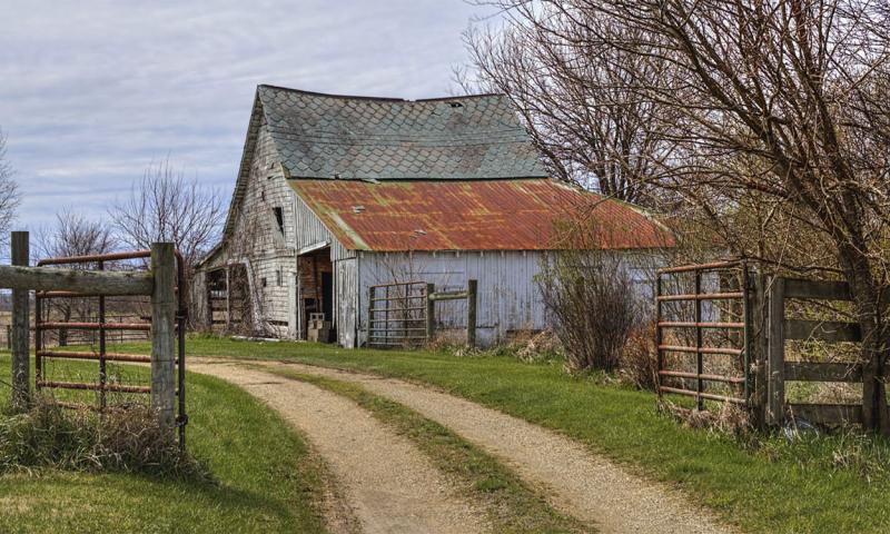 Rusty shed in a farmyard.