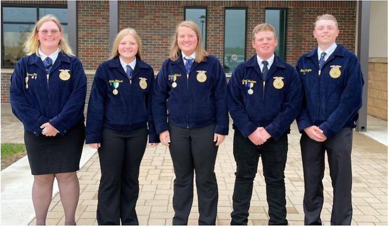 The five members of the Lemmon FFA Range Judging Team stand in a row in their blue FFA jackets.