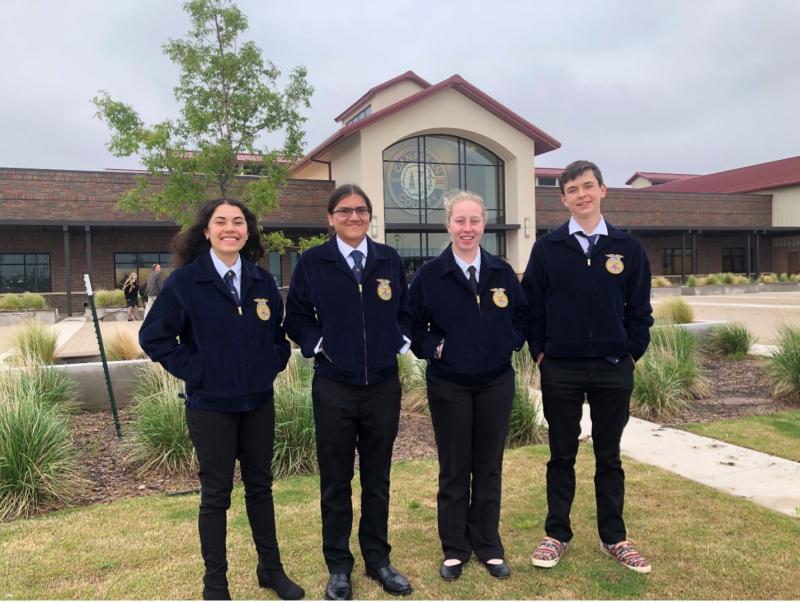 The Kadoka FFA Land Judging Team stands outside in their blue FFA jackets