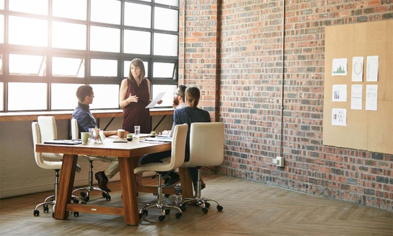 Facilitator leading a business meeting.