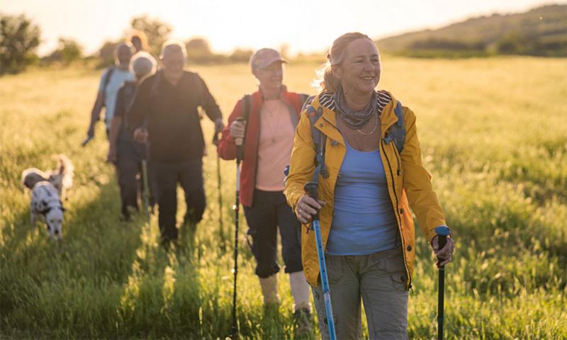Group of older adults hiking.