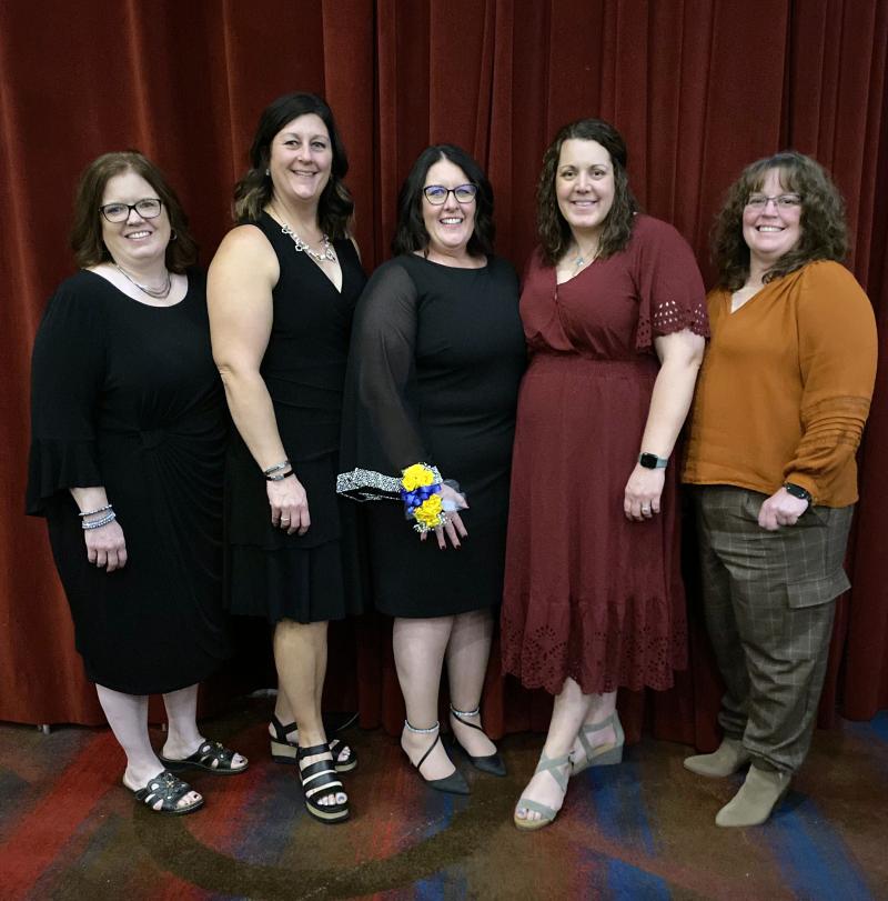 4-H professionals recognized at a national conference smile for the camera