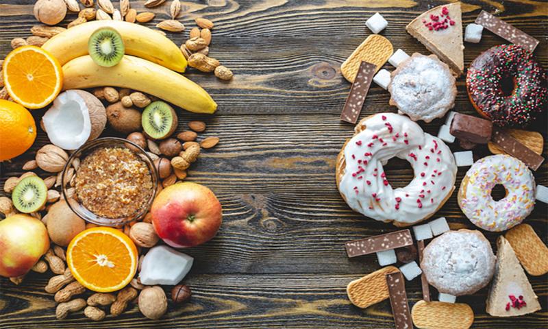 Examples of healthy and unhealthy sweets on a kitchen table.