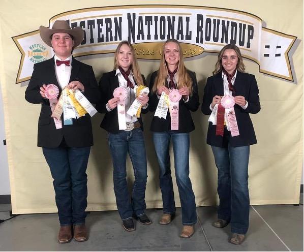 The hippology team smiles at the camera with their fourth-place ribbons