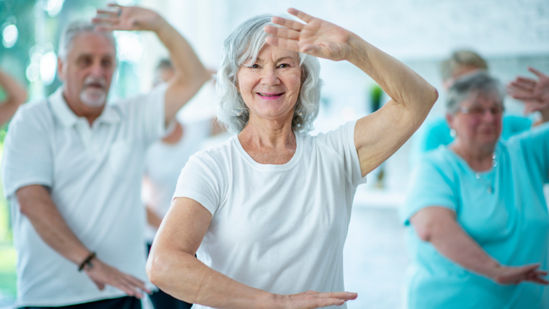 Group of older adults practicing tai chi