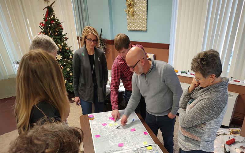 03: Wessington Springs Healthy Landscapes, Healthy Communities Initiative team gathered around a conference table.