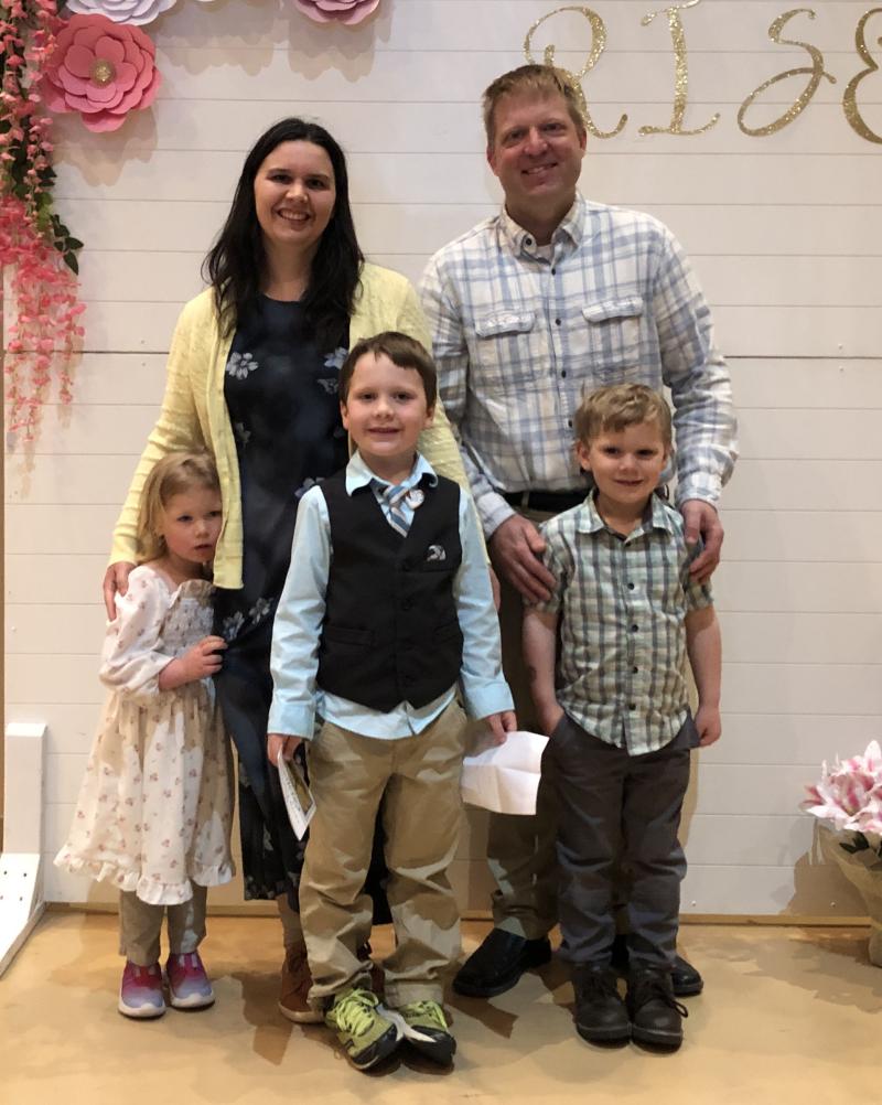 A family smiles for the camera