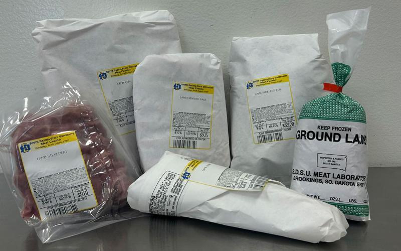 Variety of lamb meat products arranged on a counter.