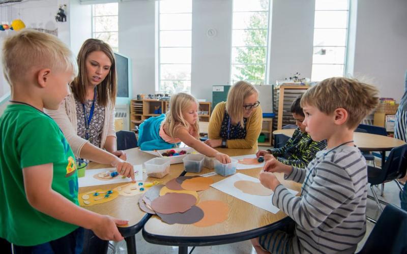 Teachers and students in an early childhood education classroom.