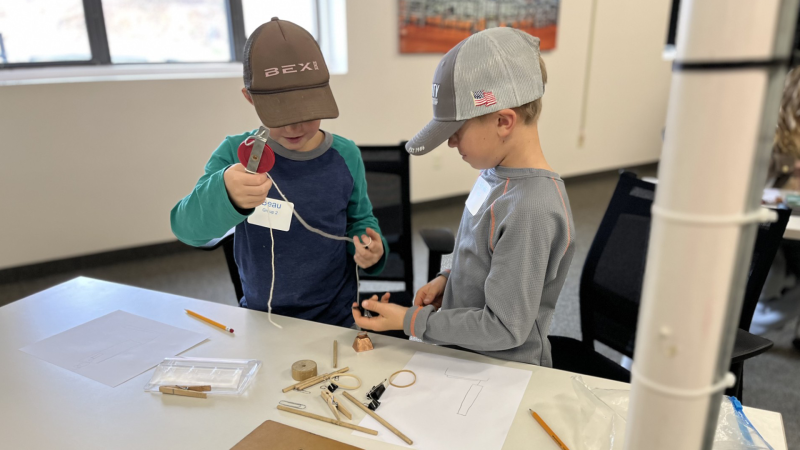 Two boys working on a project.