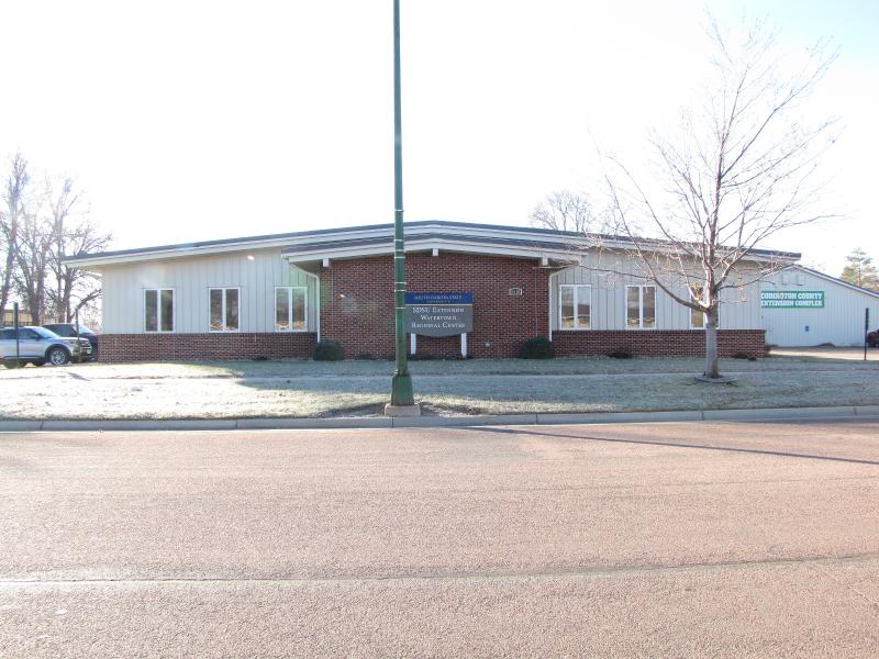 white office building near a street