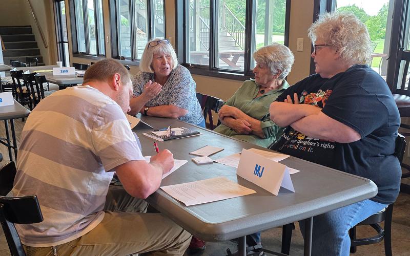 Focus group having a discussion at a table.
