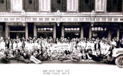 Members of the Minnehaha County 4-H club group photo in front of a building. May 3, 1930 Sioux Falls, SD