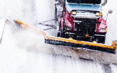 snow plow clearing a highway