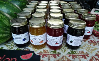 variety of home-canned jams for salw at a farmer's market