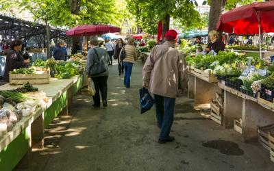 people shopping at a farmer's market