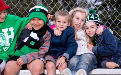 a group of young children wearing 4-H clothing