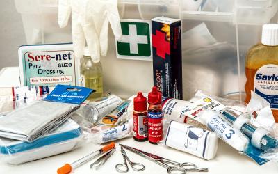a first aid kit with various medical supplies