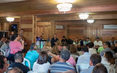 group of farmers, ranchers, and community members at a meeting. Courtesy: Gary Potts, USDA