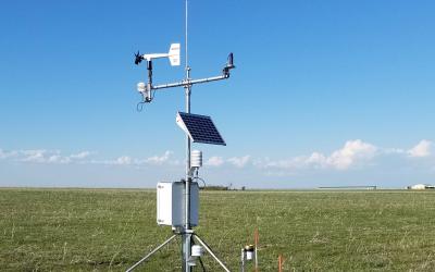 an image of outdoor weather monitoring equipment in a field