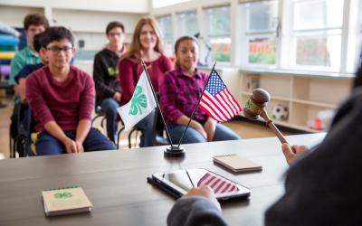 4-H meeting 4-H members sitting in a meeting