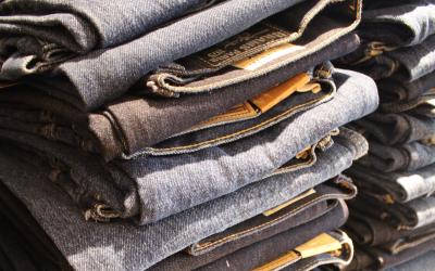 an image of several stacks of blue jeans