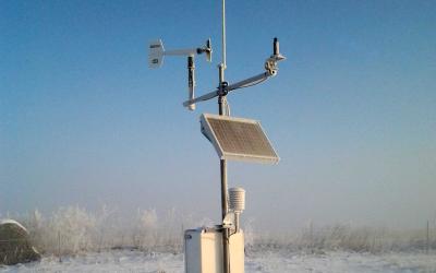 A South Dakota Mesonet station in a snow-covered field.