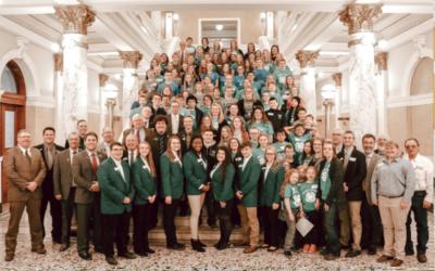 a large group of 4-H members and supporters standing on the Capitol stairs