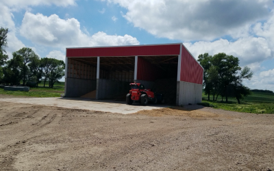 a red shed with grain stored inside