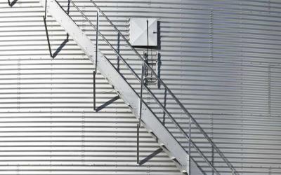 Modern grain bin exterior with built-in staircase.