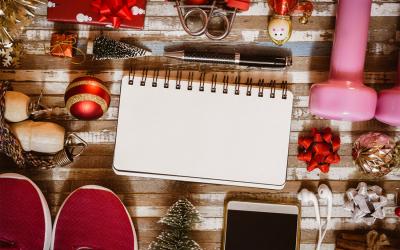 Holiday decorations and fitness equipment arranged on a tabletop.