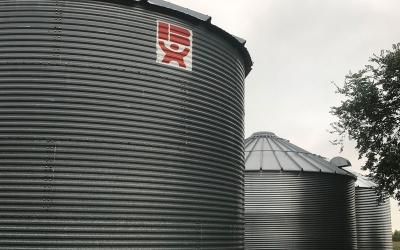 Three grain storage bins.