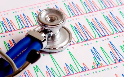 Stethoscope atop a gentic sequencing report.