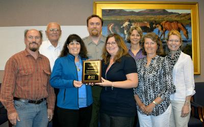 SDSU Extension community vitality team presenting an award.