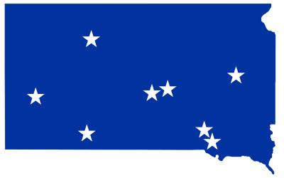 Blue map of South Dakota with white stars representing communities with active wellness coalitions, including: DeSmet, Dupree, Fort Thompson, Lower Brule, Lake Andes, Martin, Rapid City and Wagner.