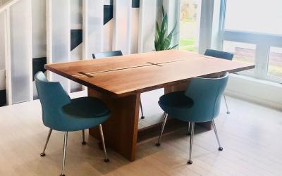 Kitchen and living area of a modern, adaptable home. Ample space throughout for wheelchair access to essential features.