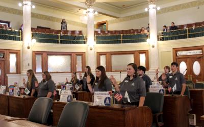 Group of 4-H youth being sworn in in the state legislative chamber in Pierre South Dakota