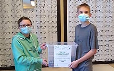 Atty Eastman, Jonathan Burleson and Joshua Burleson collecting glasses at an eye clinic for the South Dakota 4-H "20/20 Vision" community service project.