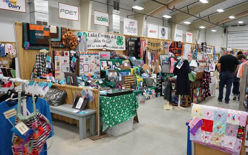 4-H exhibits displayed in a large room