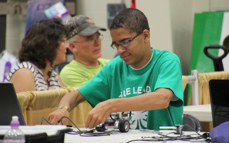 4-H member working on a robotics project
